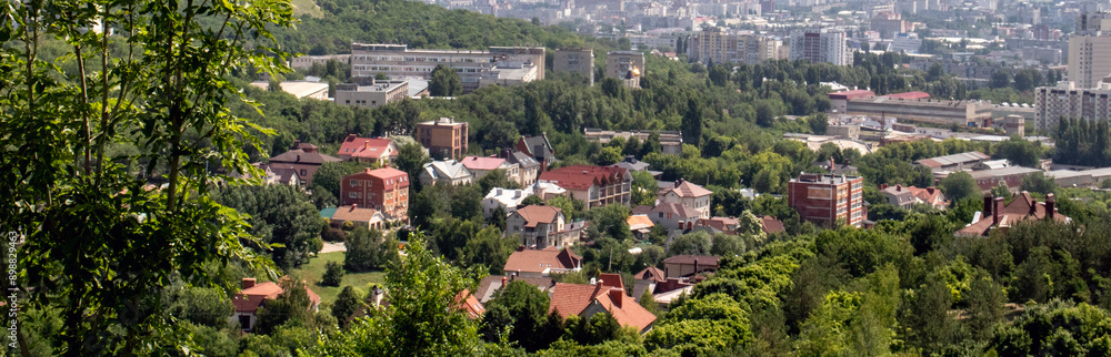 Panoramic view of the city of Saratov from a hill. The city of Saratov, panoramic view from a high hill outside the city. Residential development of the city, view from a high point on a hill. Panoramic view of the city of Saratov from a hill. The city of Saratov, panoramic view from a high hill outside the city. Residential development of the city, view from a high point on a hill.