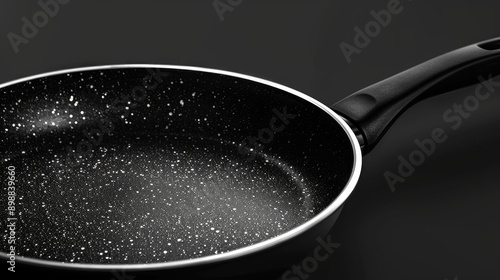 Cooking and frying pan in black and silver Teflon coating photo