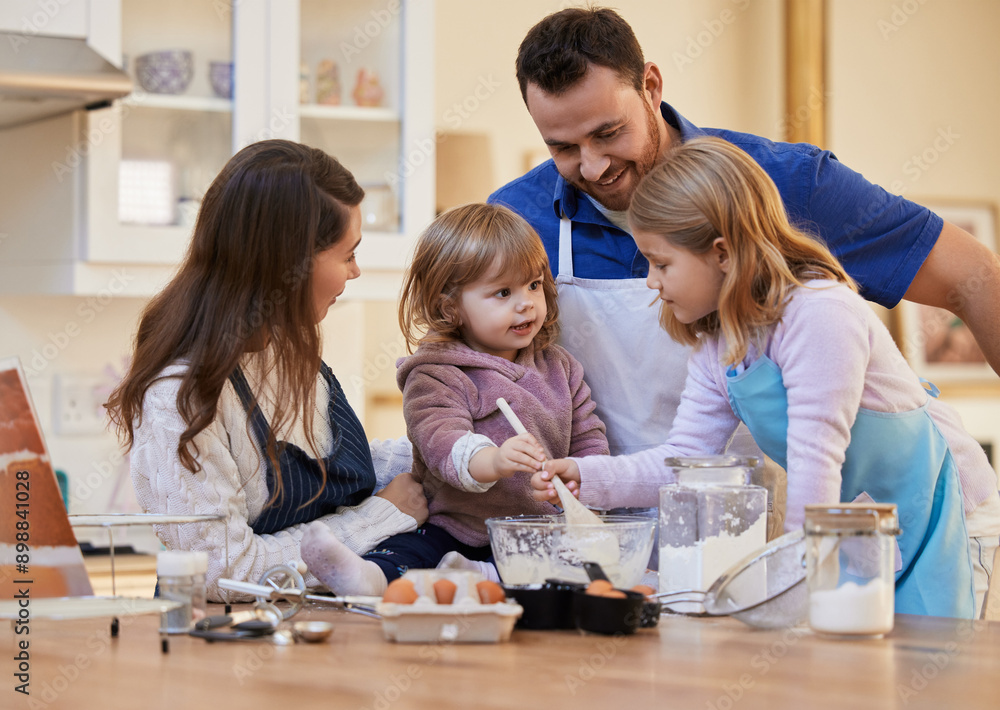 Mom, dad and children baking in kitchen with recipe for bonding, learning chef skills and fun together. Family, home and parents with girls help mix ingredients for cupcake, pancakes and sweet treats Mom, dad and children baking in kitchen with recipe for bonding, learning chef skills and fun together. Family, home and parents with girls help mix ingredients for cupcake, pancakes and sweet treats