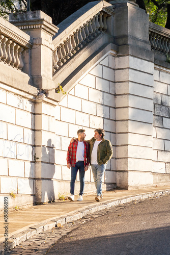Wallpaper Mural Two affectionate gay men walking on the street. Vertical shot Torontodigital.ca