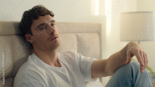 Canvas Print Caucasian European man pensive thoughtful thinking sadness bored bedroom bed hom