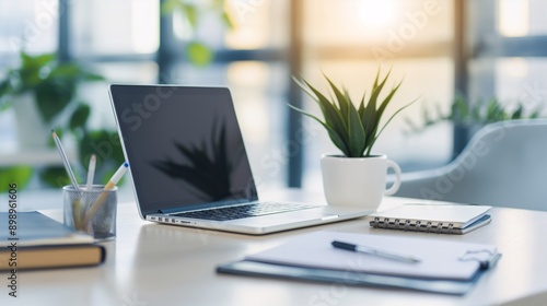 Wallpaper Mural Sunlit Workspace Serenity: A minimalist home office bathed in warm sunlight, featuring a laptop, notepad, and succulent, inviting productivity and focus.  Torontodigital.ca