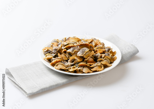 Cuadro en lienzo Close-up of stacked boiled cockle flesh on white dish, South Korea