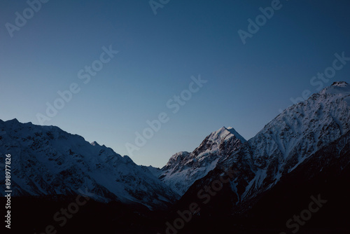 Contrail over Mountain Range at Dawn