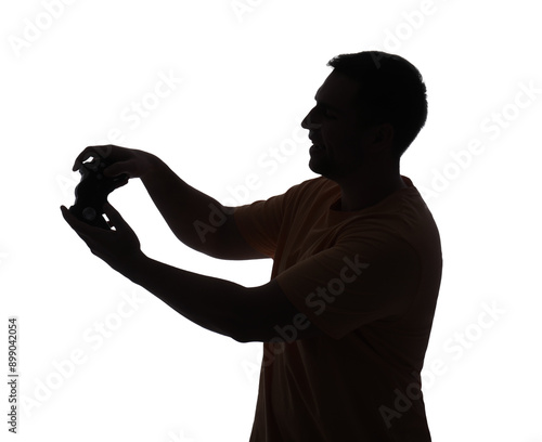 Silhouette of young man pla...