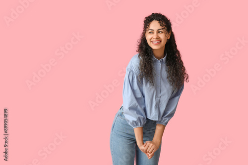 Smiling young woman with cu...