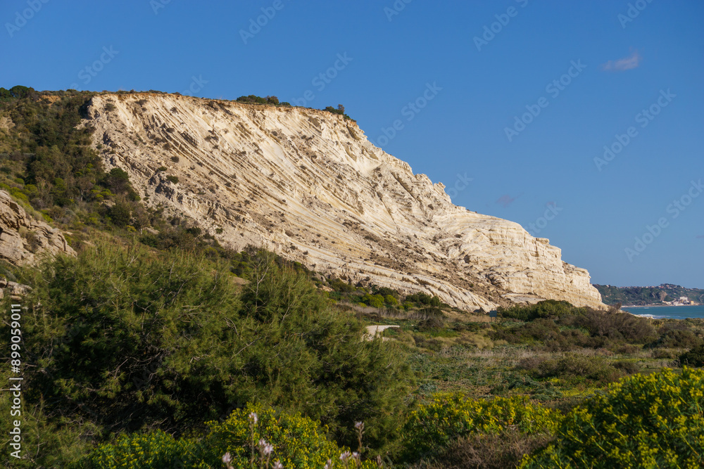 View of coastline at nature reserve of Torre Salsa with beautiful white cliffs Dama Bianca Torre Salsa on a sunny day, Sicily, Italy View of coastline at nature reserve of Torre Salsa with beautiful white cliffs Dama Bianca Torre Salsa on a sunny day, Sicily, Italy
