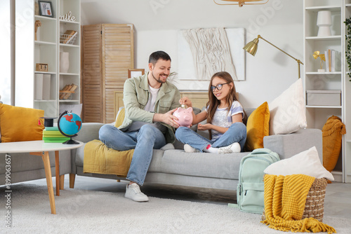 Father and his daughter put...