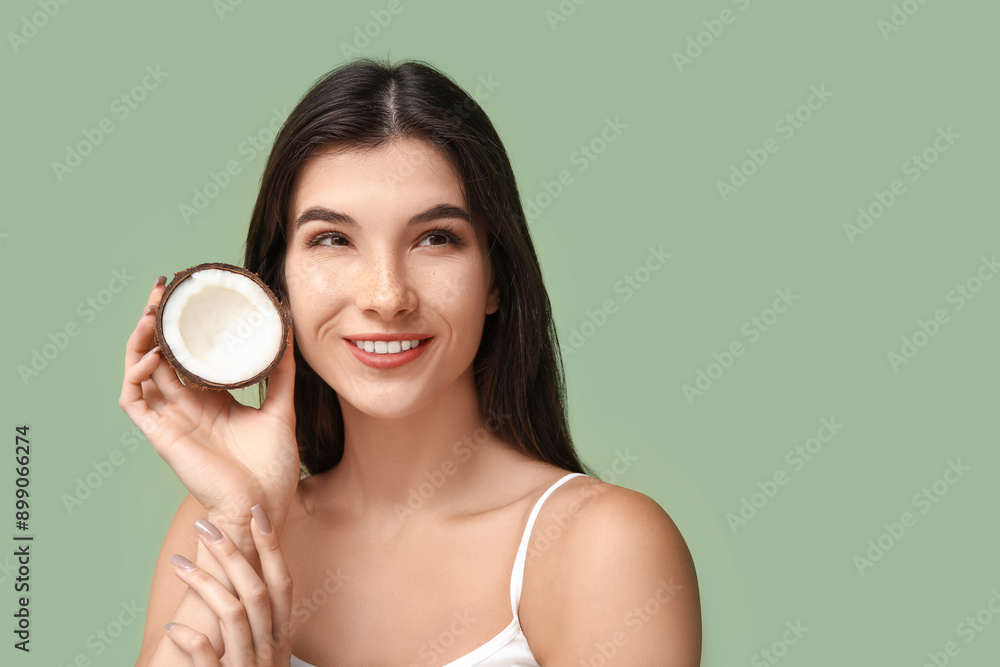 Beautiful young woman with coconut on green background. Cosmetology concept Beautiful young woman with coconut on green background. Cosmetology concept