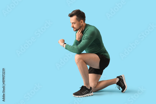 Sporty young man with smart...