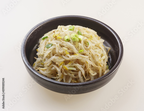 Close-up of seasoned green bean sprouts with green onion on a jar, South Korea 