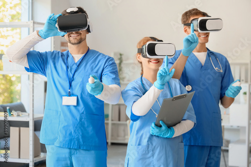 Young doctors using VR glas...