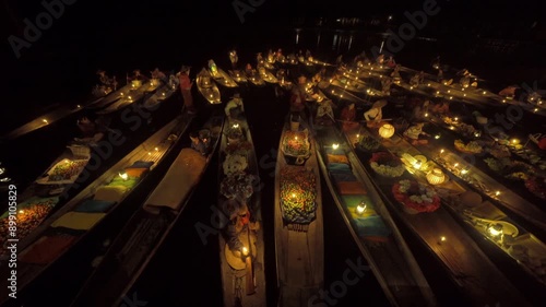 Damnoen Saduak Floating Market or Amphawa. Local people sell fruits, traditional food on boats in canal, Ratchaburi District, Thailand. Famous Asian tourist attraction destination. Festival in Asia.