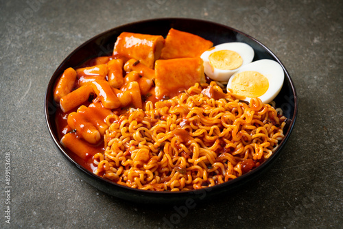 Korean instant noodles with Korean rice cake and fish cake and boiled egg photo