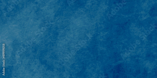 Dark Blue background with grunge backdrop texture, watercolor painted mottled blue background, colorful bright ink and watercolor textures on black paper background.