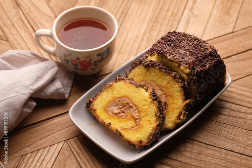 Canvastavla A roll cake is a sponge cake baked in a shallow pan, filled with jam or buttercream and then rolled