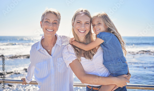 Portrait, beach and grandmother with mama, girl and time together for vacation, family and water. Seaside, women or group with summer holiday, generations and travel with happiness, cheerful and love