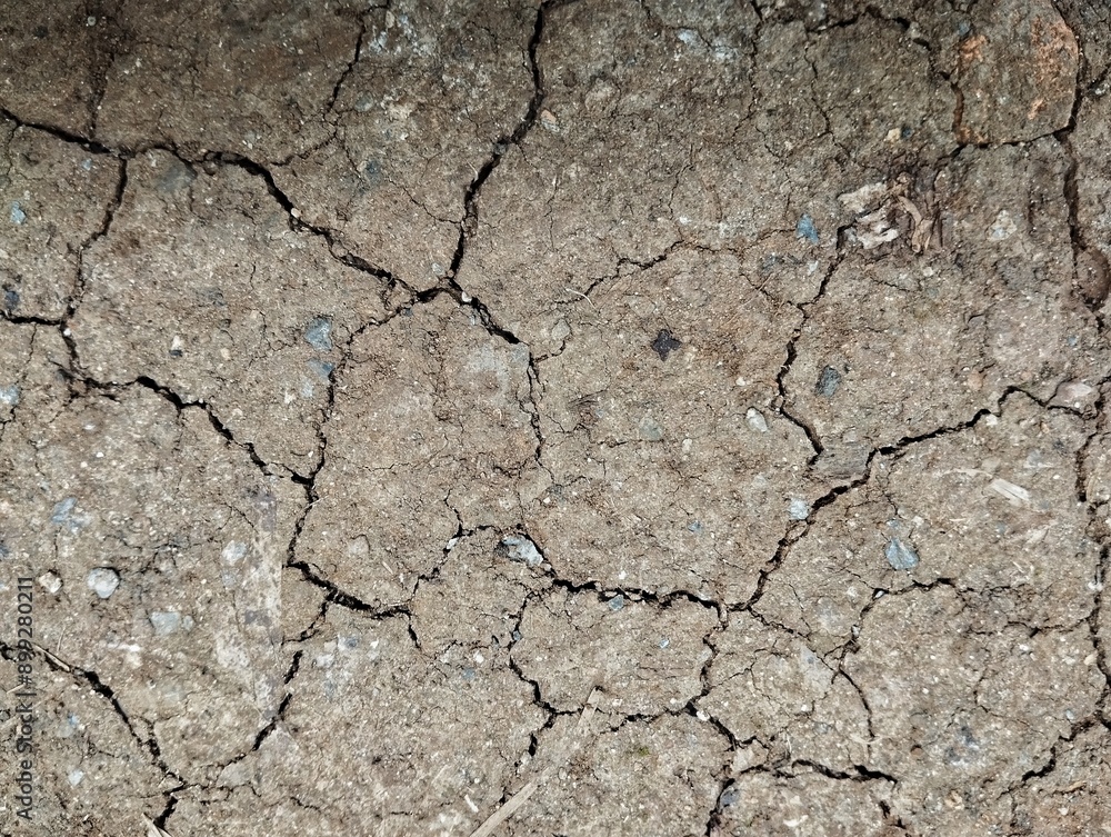 Close up shoot of grey brown dry cracked soil no water there Close up shoot of grey brown dry cracked soil no water there