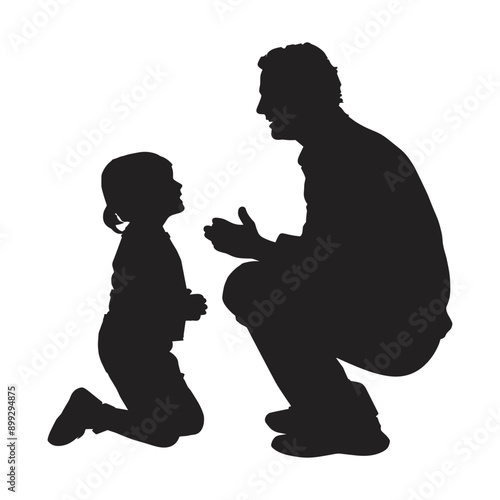 Silhouette of a father kneeling down to talk to his daughter.