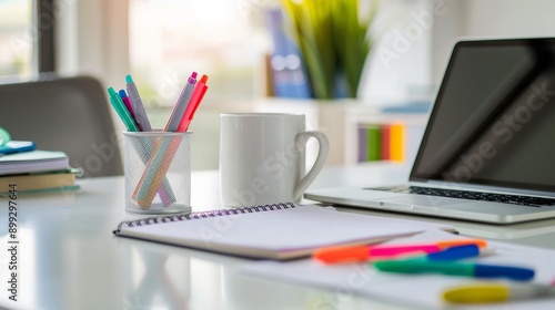 Minimalist Office Workspace with Laptop, Notebook, and Pens