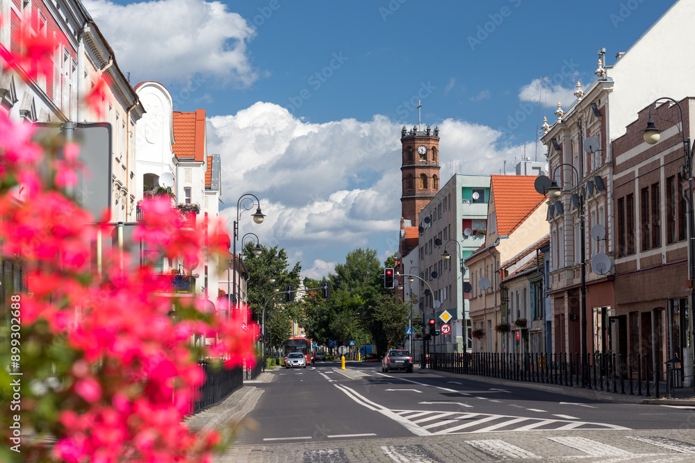 Summer cityscape of Nowa Sól, a city on the Oder River in Lubusz region, Poland. Central street with St. Anthony Church in the background.