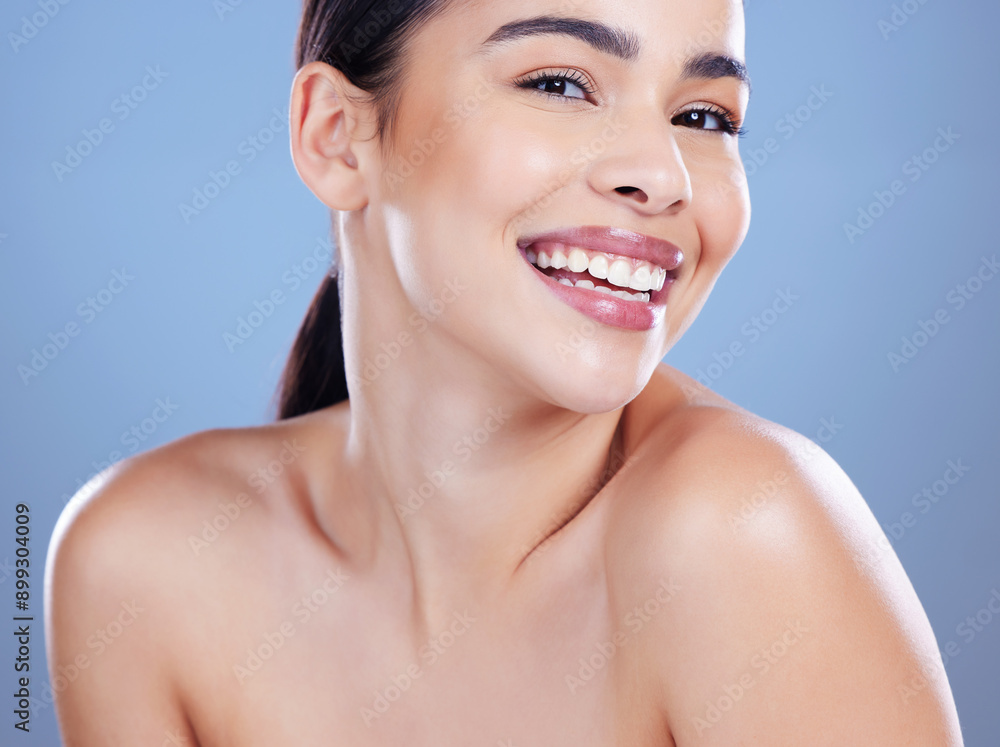 Beauty, woman and portrait smile for skincare with healthy glow, wellness and collagen cosmetics in studio. Girl, happy and dermatology for facial shine, spa aesthetic and isolated by blue background Beauty, woman and portrait smile for skincare with healthy glow, wellness and collagen cosmetics in studio. Girl, happy and dermatology for facial shine, spa aesthetic and isolated by blue background