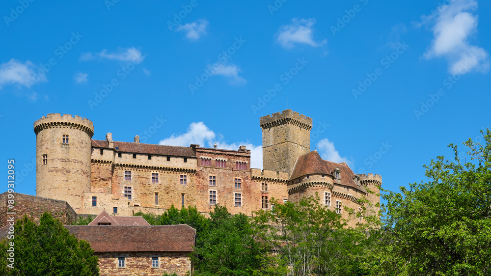 View on the medieval 12th century Chateau de Castelnau-Bretenoux castle with donjon in Prudhomat Lot Occitanie Southern France in summer under a blue sky View on the medieval 12th century Chateau de Castelnau-Bretenoux castle with donjon in Prudhomat Lot Occitanie Southern France in summer under a blue sky
