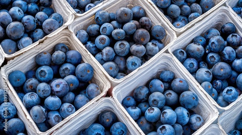 Blueberries in boxes on the store counter. Selective focus.