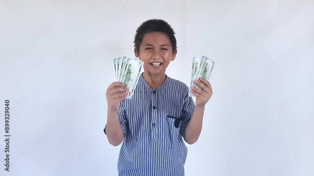 Children Asian dollars 100. Smiling kid holding hundreds of dollar money banknotes isolated white background. Portrait smiling little asian boy, dollar banknotes Children Asian dollars 100. Smiling kid holding hundreds of dollar money banknotes isolated white background. Portrait smiling little asian boy, dollar banknotes