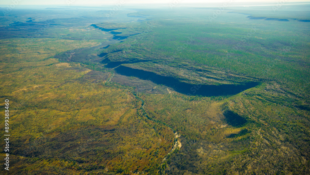Aerial view of river and escarpment at Mitchell Plateau in the far north of Western Australia Aerial view of river and escarpment at Mitchell Plateau in the far north of Western Australia