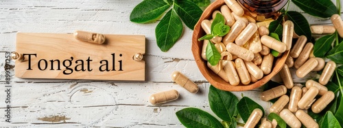 Tongkat ali plant and capsules. Selective focus.