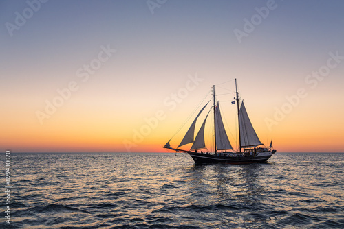 Segelschiff im Sonnenuntergang auf der Hanse Sail in Rostock photo