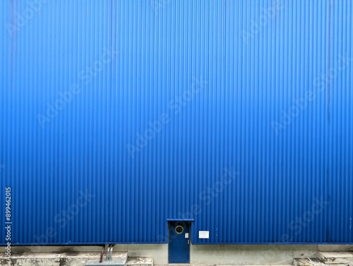 Blue door on blue background wall