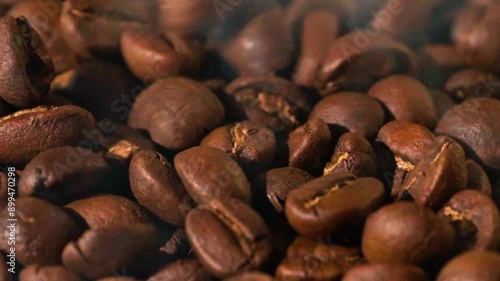 Super slow motion of flying coffee beans in speed ramping. Filmed on high speed cinema camera. morning coffee beans texture.