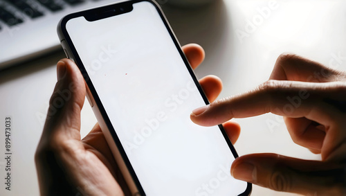 Obraz na płótnie Person holding mobile phone with blank white screen, technology and telecommunication background, template, copy space area, w salonie