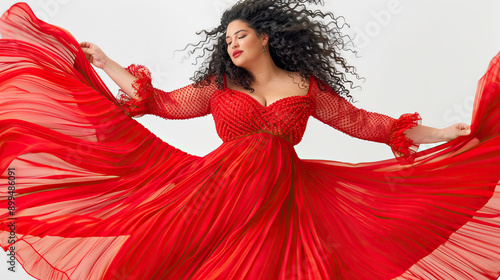 Plus-size model in a red dress dancing elegant and joyful moment vibrant and expressive movement confident and stylish portrayal dynamic and lively dance scene striking and beautiful dress photo