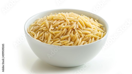 Italian orzo pasta in white bowl on white background rice like shape angled view