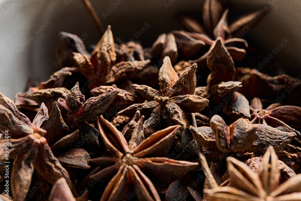 Horizontal close-up view of star anise in a bowl. Horizontal close-up view of star anise in a bowl.