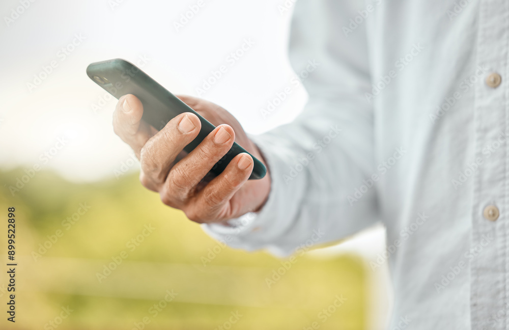 Fototapeta premium Man, phone and hand for communication in outdoor, social media surfing and online for browsing. Male person, app search and nature to relax by typing message, internet connection and website for info