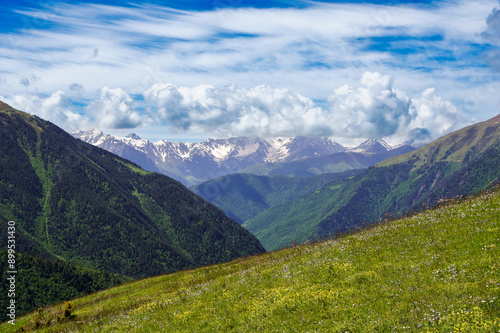 Snowy mountain peaks on the horizon.