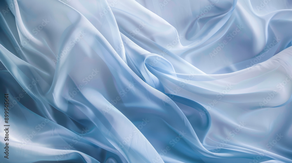 Elegant folds of light blue fabric create soft, flowing waves, combining simplicity with sophistication, highlighted by gentle light. Elegant folds of light blue fabric create soft, flowing waves, combining simplicity with sophistication, highlighted by gentle light.
