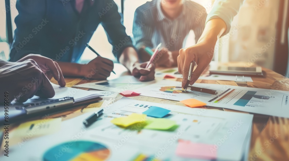 Show a marketing team in a meeting with stakeholders, discussing the alignment of marketing goals with business objectives. Show a marketing team in a meeting with stakeholders, discussing the alignment of marketing goals with business objectives.