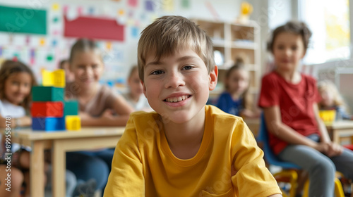 Smiling student with autism in elementary school classroom