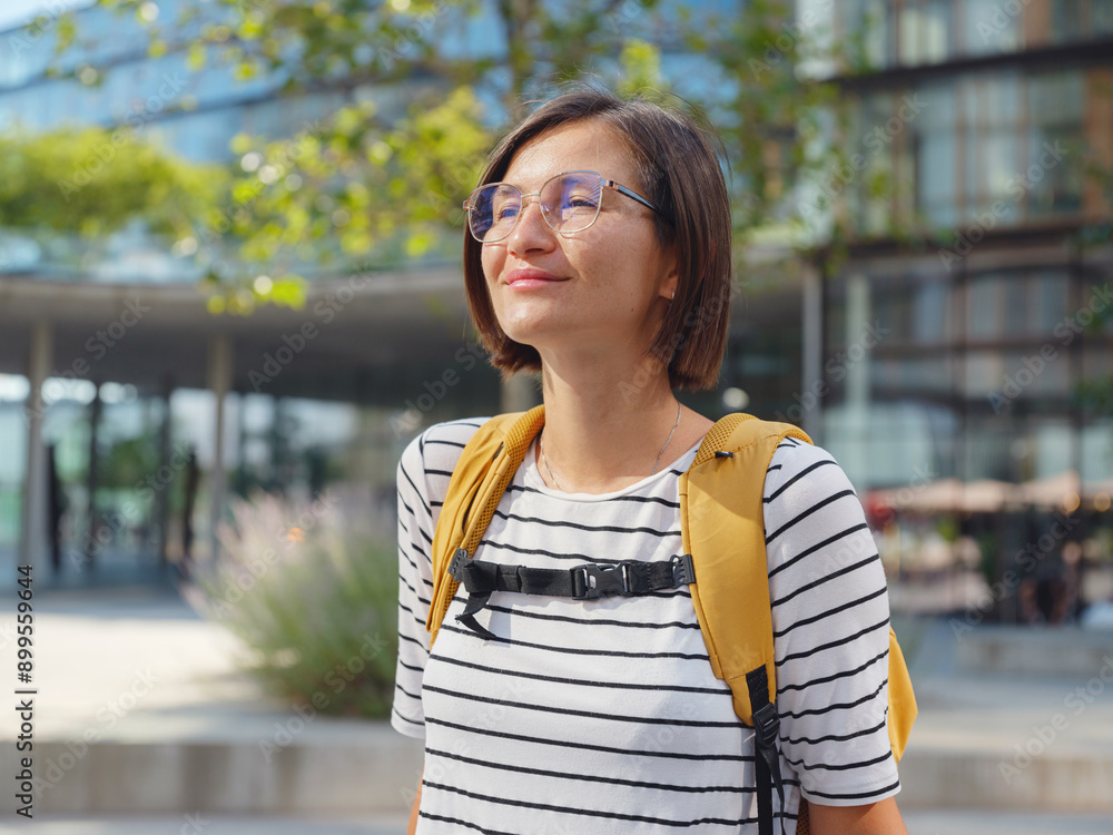 Asian woman over background of modern urban architecture in Vienna. Asian woman over background of modern urban architecture in Vienna.