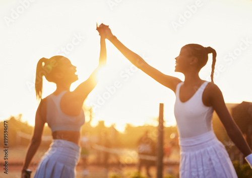 Φωτογραφία High five, women and win on tennis court for fitness, success and sportsmanship at sunset