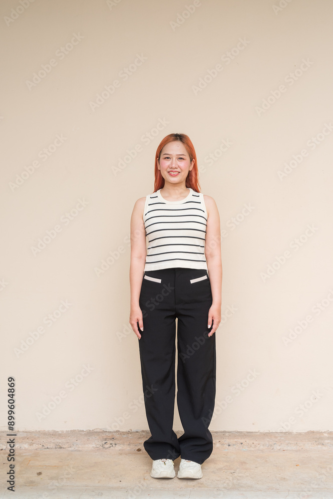 Portrait of Beautiful Woman Smiling Against Plain Background Full Length Vertical Shot Portrait of Beautiful Woman Smiling Against Plain Background Full Length Vertical Shot