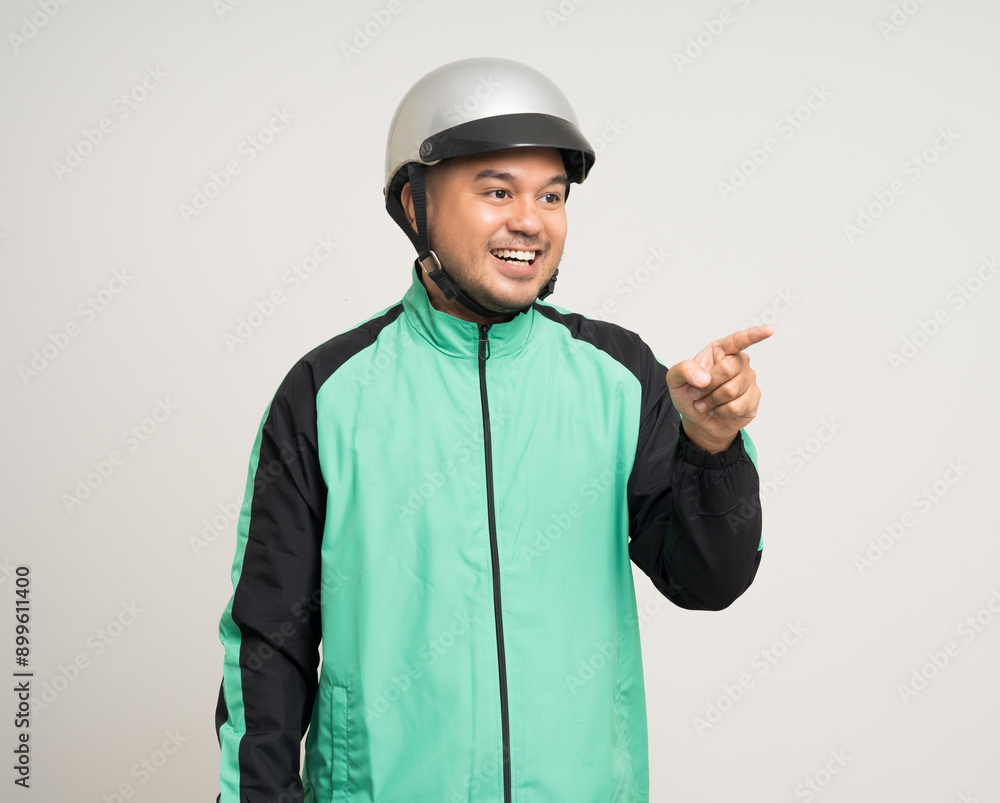 Young asian rider wearing green jacket uniform and helmet standing various action on isolated white background. Male delivery service worker. Delivery courier and shipping food service. Young asian rider wearing green jacket uniform and helmet standing various action on isolated white background. Male delivery service worker. Delivery courier and shipping food service.