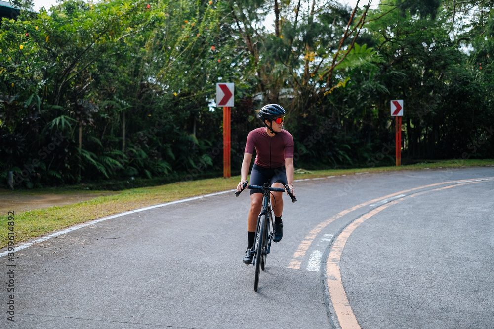 A young woman riding her bicycle in the mountains. A young woman riding her bicycle in the mountains.