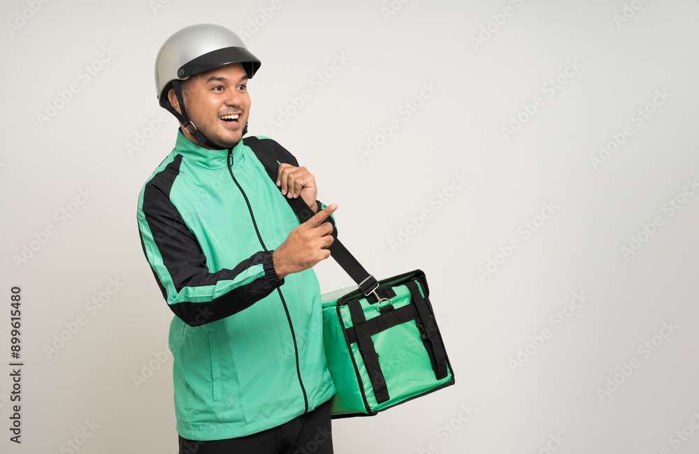 Young asian rider wearing green jacket uniform and helmet various action holding a lot of paper parcel delivery box to customer. Man service worker Courier and shipping food delivery service.