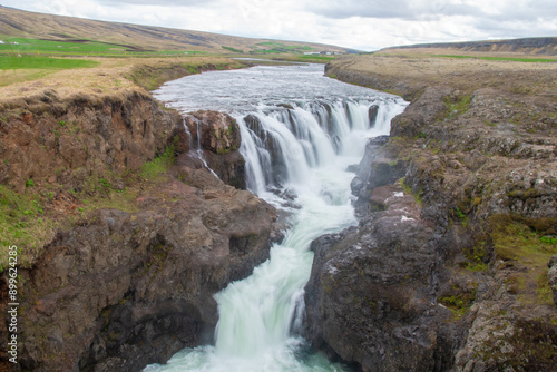 A waterfall cascade gushing down in Iceland